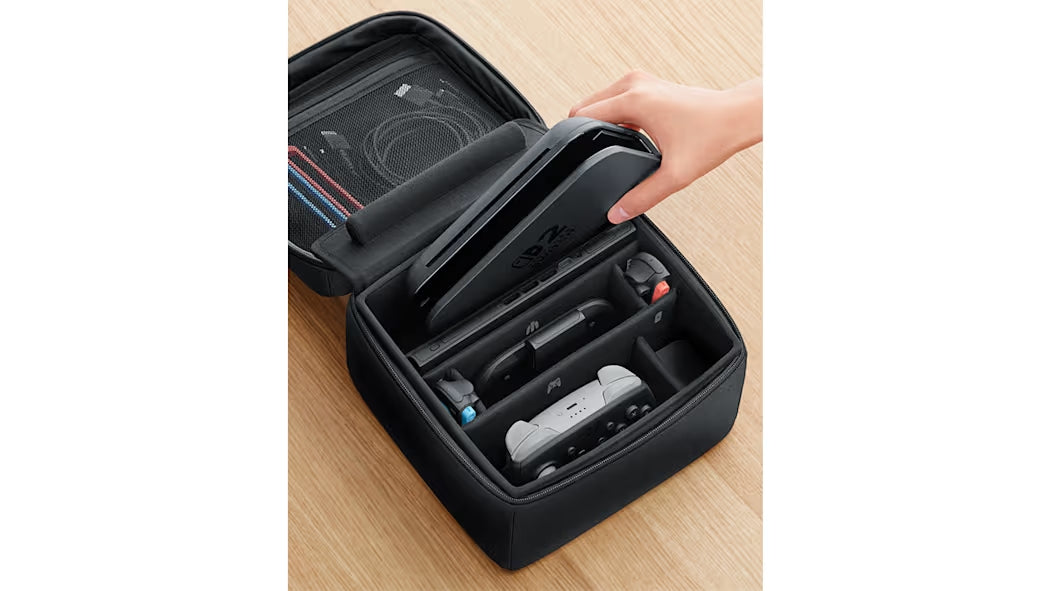 "Open view of the Nintendo Switch 2 All-In-One Carrying Case, displaying its organized interior compartments that provide storage for the console, accessories, and other gaming items."