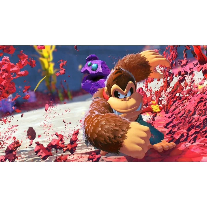 "In-game screenshot from Donkey Kong Country: Banana Bonanza – Nintendo Switch 2 Edition, showcasing Donkey Kong using one of his special moves to defeat enemies in a dynamic combat scene."
