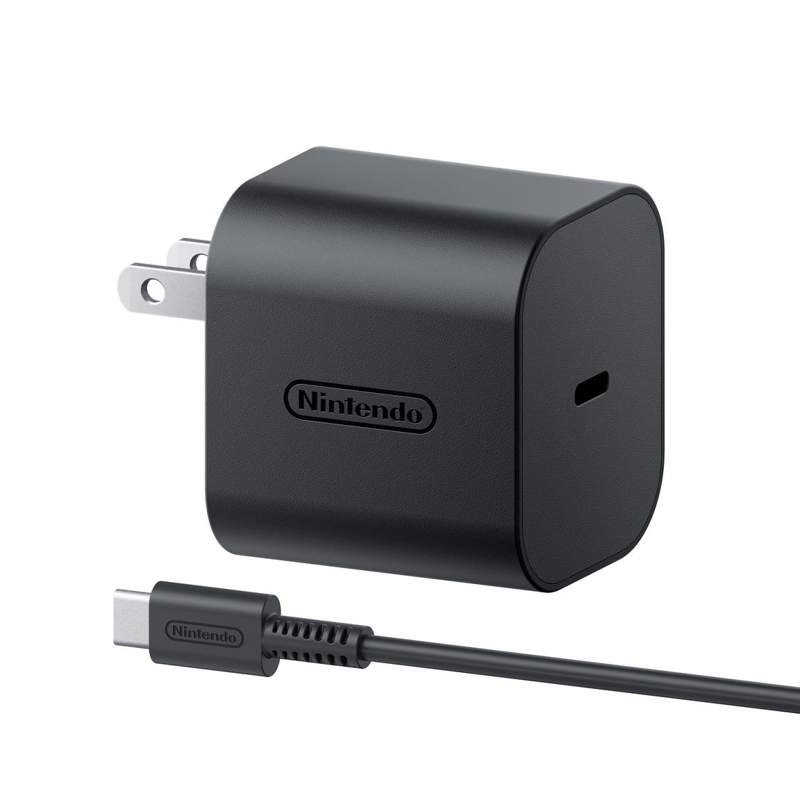 "Close-up view of the Nintendo Switch 2 AC Adapter plug, showcasing its compact design and compatibility with standard electrical outlets."